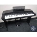 A Yamaha Clavinova CVP-20 electric keyboard on stand with stool CONDITION REPORT: