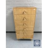 A mid twentieth century teak six drawer chest