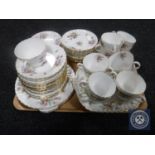 A tray containing a fifty-five piece Minton Marlow china tea service