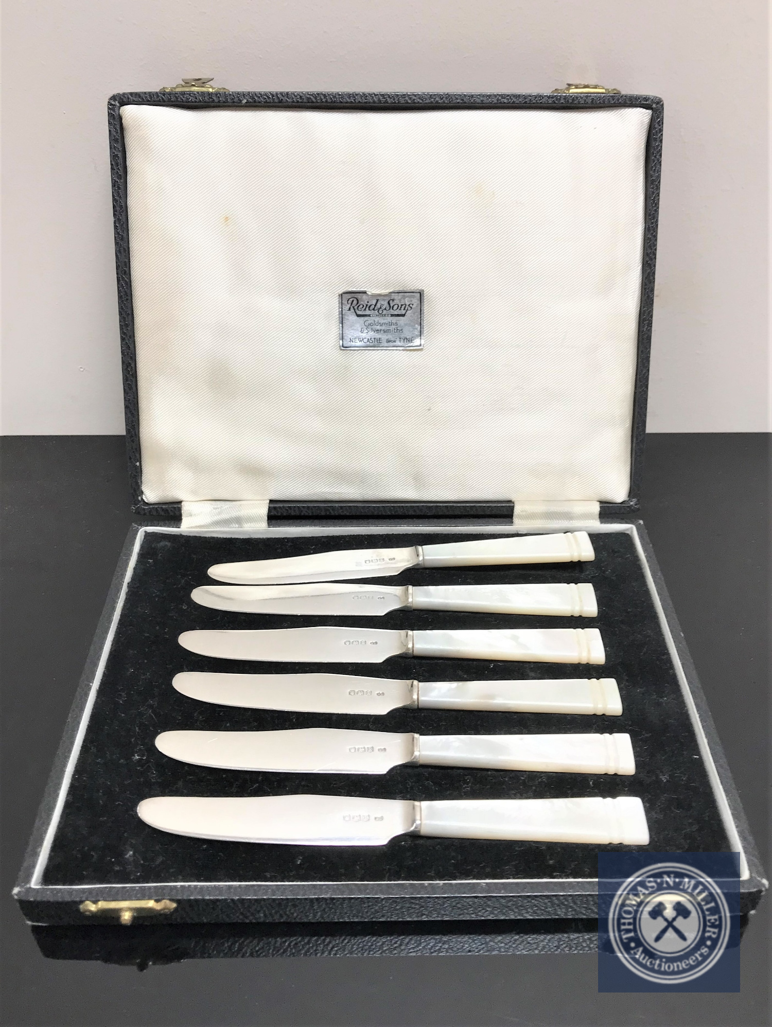 A set of six silver and mother of pearl handled dessert knives