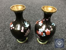 A pair of black cloisonne floral vases,