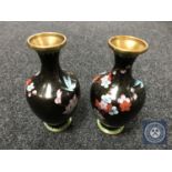 A pair of black cloisonne floral vases,