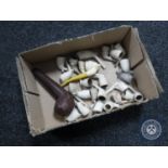 A box of assorted clay pipes
