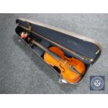 A 20th century Stradivarius copy violin and bow in case