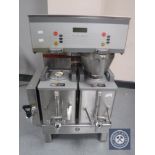 A stainless steel commercial coffee machine