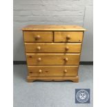 A pine five drawer chest