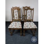 A set of four oak Old Charm tapestry upholstered dining chairs