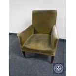 An Edwardian Regency style library armchair upholstered in green dralon