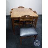 A mid twentieth century Danish teak extending table and six chairs