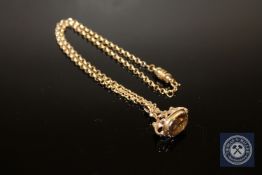 A 9ct gold citrine set fob on chain with magnetic clasp