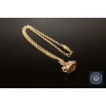 A 9ct gold citrine set fob on chain with magnetic clasp