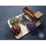 A tray of antique glass balls, miniature crib,