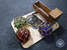 A tray of antique glass balls, miniature crib,