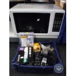 A Kenwood microwave together with a box containing mobile phone, darts etc.