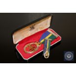 An Elizabeth II Territorial & Army Volunteer Reserve decoration in silver with miniature,