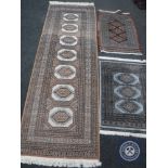 A runner and two other rugs CONDITION REPORT: The runner is 241cm long and 80cm