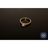 An 18ct gold diamond solitaire ring, approximately 0.25ct, size M.