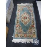 A fringed Chinese rug CONDITION REPORT: 175cm by 77cm.