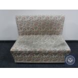 An early twentieth century floral upholstered storage bench