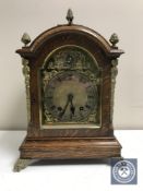 A late Victorian oak eight day bracket clock with brass dial and mounts