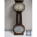 A mahogany barometer with silvered dial,