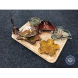 A tray containing six mid 20th century coloured glass bowls together with a glass fish ornament