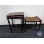 A nest of three mahogany tables together with a mahogany bergere seated dressing table stool
