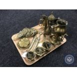 A tray of assorted brass ware including three mortar and pestles, brass spirit kettle on stand,