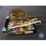 A box of brass embossed wall plaque, bed warming pan, pair of brass cutlasses,