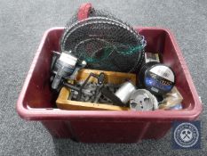 A box of fishing equipment including reels, line, weights,