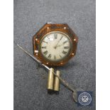 An antique timepiece with mother of pearl inlaid case together with two weights and pendulum