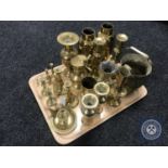 A tray of a quantity of brass ware including vases, candlesticks,