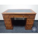 A Victorian mahogany child's writing desk fitted nine drawers