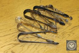 Eight pairs of Georgian silver sugar tongs,