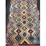 An Afghan wool rug,
