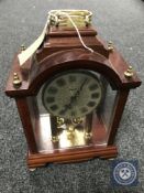 A Kundo quartz mantel clock CONDITION REPORT: Generally in good condition though
