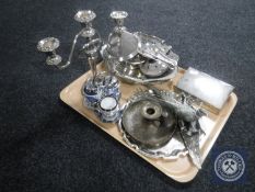 A tray of silver plated items, cigarette box, card tray, candelabrum, cruet set,