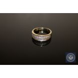 A 9ct gold diamond set band ring,
