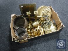 A box of assorted metal ware including brass Corinthian column candlesticks, horse brasses,