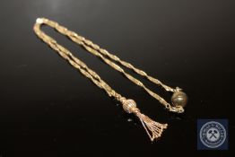 A 9ct gold tassel pendant on twist chain with magnetic clasp CONDITION REPORT: This