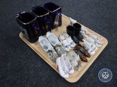 A tray of three Martel Grand National water jugs together with a collection of china shoes