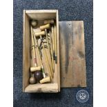 An early 20th century miniature croquet set in pine box