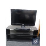 A Toshiba 32 inch LCD TV on stand