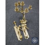 A decorative brass six-way table candelabrum together with a pair of brass cherub sconces