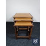 A nest of three teak G Plan tables