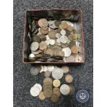 A tin containing a quantity of pre-decimal and decimal British coinage