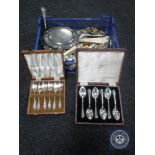 A basket containing assorted plated flatware, pewter scalloped-edge card tray,