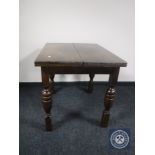 A 20th century oak pull out dining table