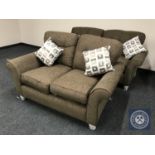 A three seater and two seater settees in brown fabric with loose cushions