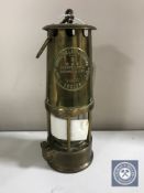 A brass Eccles Protector miner's lamp